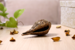 Brass metal conch shell figurine